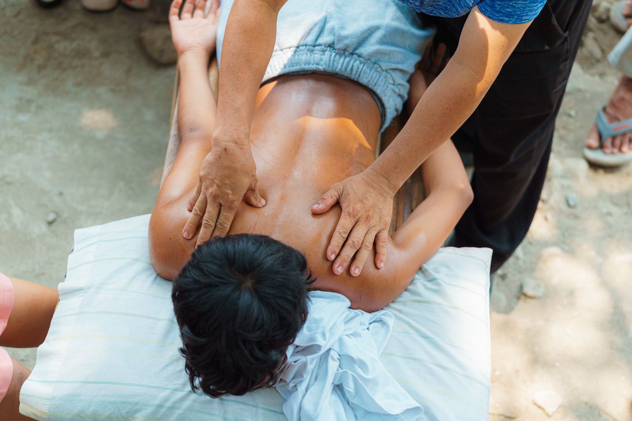 contact-img A relaxing outdoor back massage session providing stress relief and wellness benefits.