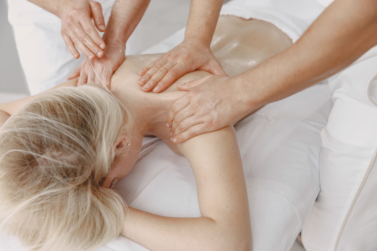 The Art of Drawing Readers In: Your attractive post title goes here Woman receiving a relaxing back massage promoting wellness and stress relief.